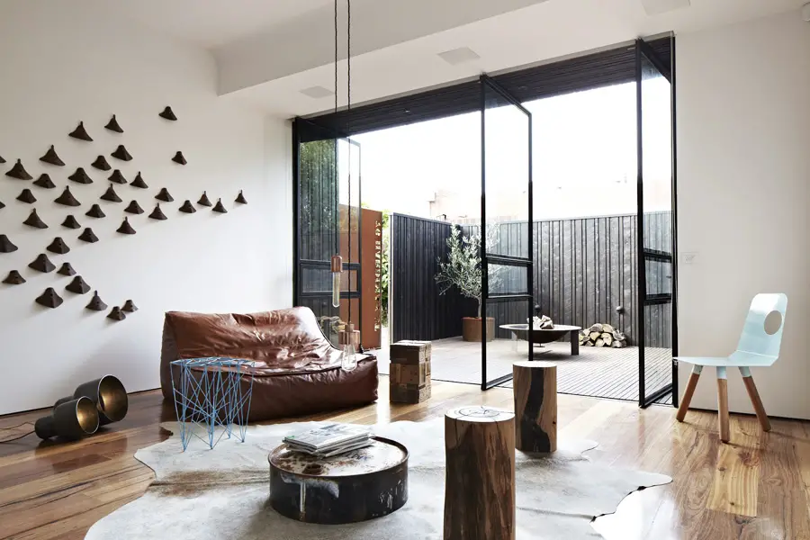 House Living Room with Brown Sofa and Low Table on Animal Skin Rug