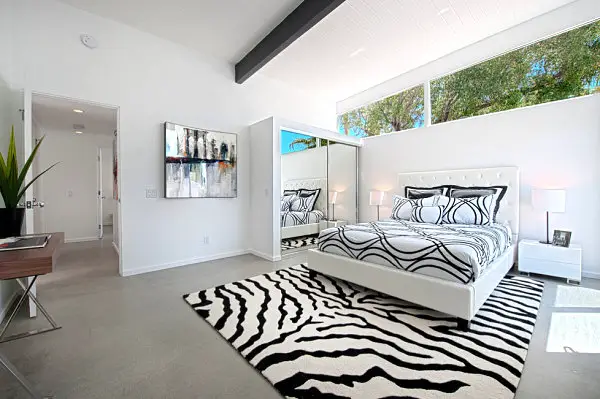 White Bed Linen White Pillows and White Rug Carpet with Black Pattern