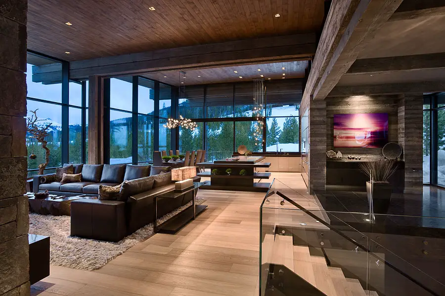 Interior, horizontal, overall living area, dining area and kitchen at twilight, Taylor residence, Yellowstone Club, Big Sky, Montana; Reid Smith Architect; LC2 Design Services; Teton Heritage Builders; Montana Reclaimed Lumber