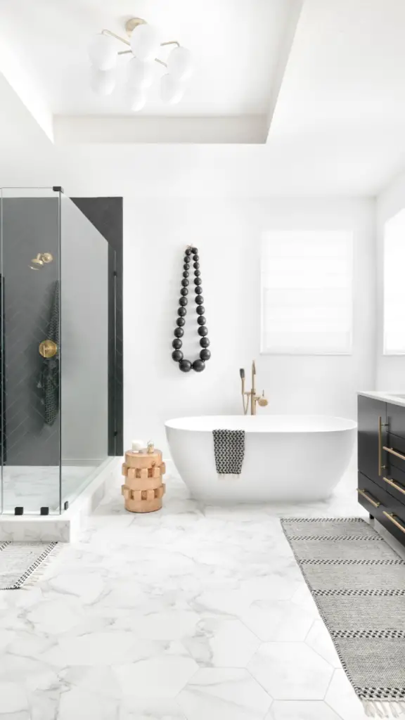 Black and White Bathroom with Gold Accents [Source: https://pin.it:2zjAuKk]